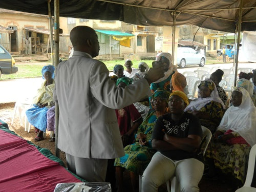 man talking to group of people